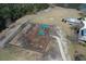 Aerial view of a fenced community playground with slides, swings, and a picnic table near a walking path at 317 Cantley Ct, Summerville, SC 29486