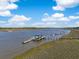 Aerial view showcasing the waterway, dock and marsh landscape at 3398 Freeman Hill Rd, Johns Island, SC 29455