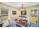 This dining room has a wooden table and view of the water at 3398 Freeman Hill Rd, Johns Island, SC 29455