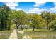 Charming home nestled among beautiful trees with a private dock extending into the marsh at 3398 Freeman Hill Rd, Johns Island, SC 29455