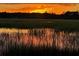 Sun setting behind the marsh provides a lovely and peaceful setting at 3398 Freeman Hill Rd, Johns Island, SC 29455