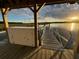 This image shows a pier with a cabinet alongside the water at 3398 Freeman Hill Rd, Johns Island, SC 29455