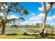 Waterway view of private dock, marshland and lush trees at 3398 Freeman Hill Rd, Johns Island, SC 29455