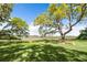 Spacious yard with grand old oak trees draped in spanish moss at 3398 Freeman Hill Rd, Johns Island, SC 29455