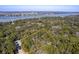 Beautiful wooded homesite with waterfront access and serene views highlighted by a yellow boundary line at 3434 Kit Freeman Ln, Johns Island, SC 29455