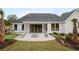 Beautiful backyard featuring a patio with a fire pit, a manicured lawn, and a putting green at 3434 Kit Freeman Ln, Johns Island, SC 29455
