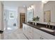 Elegant bathroom with double vanity, marble floors, and a large walk-in closet at 3434 Kit Freeman Ln, Johns Island, SC 29455