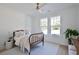 Bright bedroom with natural light, wood floors, and a vintage-style bed at 3434 Kit Freeman Ln, Johns Island, SC 29455