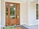 Attractive front entrance with a wooden door, side lights, and sidelight windows at 3434 Kit Freeman Ln, Johns Island, SC 29455