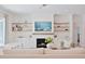 Well-lit living room showcasing a fireplace with built-in shelves and comfortable seating at 3434 Kit Freeman Ln, Johns Island, SC 29455
