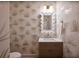 Chic powder room featuring palm-leaf wallpaper and a decorative mirror at 3434 Kit Freeman Ln, Johns Island, SC 29455