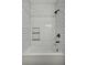 Clean white tiled bathtub and shower combination with a built-in niche and modern fixtures at 3676 Shutesbury St, Mount Pleasant, SC 29466