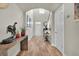 Inviting foyer with hardwood floors, stylish console table, and elegant decor creating a warm ambiance at 3676 Shutesbury St, Mount Pleasant, SC 29466