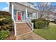 Inviting front porch with brick steps, white railing, and a vibrant red door offering a welcoming entrance at 3676 Shutesbury St, Mount Pleasant, SC 29466