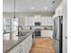 Modern kitchen with stainless steel appliances, granite countertops, and white cabinetry offering ample storage at 3676 Shutesbury St, Mount Pleasant, SC 29466