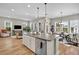 Open-concept kitchen featuring a large island, stainless steel appliances, and hardwood floors perfect for entertaining at 3676 Shutesbury St, Mount Pleasant, SC 29466