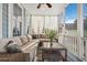 Inviting screened porch features comfortable sectional seating and an attractive outdoor living space at 3676 Shutesbury St, Mount Pleasant, SC 29466