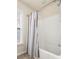 Bathroom featuring a shower and bathtub with a decorative curtain, with natural light from a window at 406 Butterfly Bush Dr, Goose Creek, SC 29445