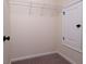 A walk-in closet with carpeted floors, a shelf, and a light at 406 Butterfly Bush Dr, Goose Creek, SC 29445