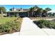 Exterior view of community clubhouse with lush landscaping and ample parking at 406 Butterfly Bush Dr, Goose Creek, SC 29445