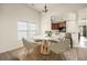 Cozy dining area featuring modern round table, furniture, and natural light from large windows at 406 Butterfly Bush Dr, Goose Creek, SC 29445