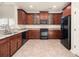 Kitchen with dark wood cabinets, granite countertops, stainless steel appliances at 406 Butterfly Bush Dr, Goose Creek, SC 29445