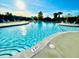 Sparkling community pool with lounge chairs and sunshade offers a resort-like experience at 406 Butterfly Bush Dr, Goose Creek, SC 29445