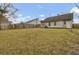 Backyard with a full lawn and privacy fence at 4064 Bonaparte Dr, North Charleston, SC 29418