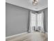 Well-lit bedroom featuring contemporary flooring, neutral wall color, and bright windows at 4064 Bonaparte Dr, North Charleston, SC 29418