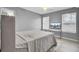 Comfortable bedroom with two bright windows and a ceiling fan at 4064 Bonaparte Dr, North Charleston, SC 29418