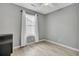 Bright bedroom with modern wood floors, neutral paint, and window with bright natural light at 4064 Bonaparte Dr, North Charleston, SC 29418