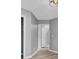 Hallway with modern flooring, neutral paint, and doorways leading to multiple rooms at 4064 Bonaparte Dr, North Charleston, SC 29418