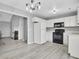 Well-lit kitchen featuring white cabinets, modern appliances, and sleek countertop space at 4064 Bonaparte Dr, North Charleston, SC 29418
