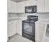 Updated kitchen with stainless steel oven and sleek white cabinets at 4064 Bonaparte Dr, North Charleston, SC 29418