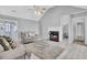 Spacious living room with a fireplace, comfortable seating, and bright natural light at 4064 Bonaparte Dr, North Charleston, SC 29418
