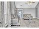 Cozy living room with neutral-toned sofas, rug, and large windows for ample natural light at 4064 Bonaparte Dr, North Charleston, SC 29418