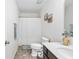 Half bathroom with tile floors, white vanity, framed mirror and shower/tub combination at 464 Fox Sparrow Ct, Summerville, SC 29486