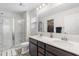 Bathroom featuring double sinks, framed mirror, and glass door shower at 464 Fox Sparrow Ct, Summerville, SC 29486