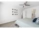 Bright bedroom features a ceiling fan and a collection of framed photos adorning the wall at 464 Fox Sparrow Ct, Summerville, SC 29486