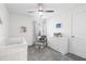Cozy Bedroom featuring a white crib, a comfortable glider, and neutral decor at 464 Fox Sparrow Ct, Summerville, SC 29486