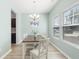 Bright dining room featuring natural light, luxury vinyl plank flooring, and a decorative chandelier at 464 Fox Sparrow Ct, Summerville, SC 29486