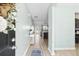 Inviting entryway featuring light-colored walls, luxury vinyl plank flooring, and a view of the living area at 464 Fox Sparrow Ct, Summerville, SC 29486