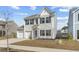 Charming two-story home with a two-car garage, manicured lawn, and traditional design in a suburban neighborhood at 464 Fox Sparrow Ct, Summerville, SC 29486