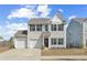 Charming two-story home featuring a two-car garage, a well-manicured lawn, and classic architectural details at 464 Fox Sparrow Ct, Summerville, SC 29486