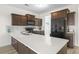 Modern kitchen with stainless steel appliances, dark cabinetry, and an island with a white countertop at 464 Fox Sparrow Ct, Summerville, SC 29486