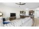 Open floor plan with living room connected to the kitchen featuring dark cabinets and stainless steel appliances at 464 Fox Sparrow Ct, Summerville, SC 29486
