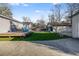 Large backyard features a wooden deck, lush artificial turf, and a versatile garage at 5034 Pittman St, North Charleston, SC 29405