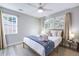 Serene bedroom featuring a cozy bed, natural light, and neutral decor for a relaxing atmosphere at 5034 Pittman St, North Charleston, SC 29405
