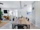 Bright dining space featuring a wooden table, views into the living room, and elegant decor at 5034 Pittman St, North Charleston, SC 29405