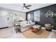 Inviting living room with a neutral sofa, accent wall, and view of the entryway and desk at 5034 Pittman St, North Charleston, SC 29405